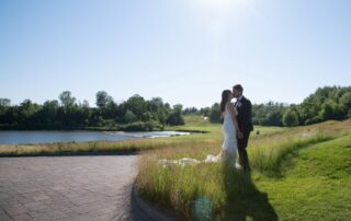 The young couple standing on Eagle Nest Golf hills for their photoshoot.