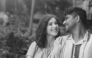 Generally, couples feel uncomfortable on their pre-wedding shoot. But with the right direction, you can make your investment worth it. Check out here how to get comfortable on your pre-wedding shoot. Pre-wedding shoot isn't just a shoot but an opportunity to make life-time memories before you both tie the knot. As pre-wedding photographers in Toronto, we have seen couples becoming uncomfortable in front of the camera, and believe us, it's not just one or two, but a majority of couples feel this way. As expert pre-wedding photographers in Toronto, we believe its high time couples overcome their awkwardness and confidently engage in pre-wedding shoots. We've developed specific strategies and tips to help your shoot feel natural, fun, and memorable. Tips to Become Comfortable On Pre-Wedding Shoots Choose a Photographer who connects with you While you may find hundreds of pre-wedding photographers in Toronto, the one you feel most at ease with can be the right one. At Origin Weddings, we recommend that all our readers invest in a pre-wedding photographer who not only understands technicalities but also connects with you on a personal level. Your photographer should be someone you can laugh with, tell your problems to, and, most importantly, trust. When there's a genuine connection, the feeling will be more than simply posing for the camera, but sharing real moments of joy and love. Plan outfits that make you "comfortable" The most effective tip to remain comfortable during your pre-wedding shoot is to wear the clothes that make you feel like "YOU" as a couple. As professional pre-wedding photographers in Toronto, we always advise our clients to choose outfits that suit their personality. This will not only boost their confidence but also help them understand the importance of a pre-wedding photoshoot that goes beyond just poses. Pick Locations That Mean Something Your chosen location for a pre-wedding photoshoot determines a lot about your comfort level during the shoot. It is wise to select a location that's somehow linked to your relationship. It could be a park where you took your first walk together, the café where you spent hours chatting, or a scenic spot in Toronto that both of you love visiting. This way, you will remain familiar with the vibe and ambiance of the location and be comfortable enough to focus on each other rather than adjusting to a new environment. Practice poses to reduce awkwardness It is always better to practice in a closed room than in front of thousands of people, and the same goes for pre-wedding photo shoots. By giving yourself the time to practice, you can take your pre-wedding photo shoot to a whole new level. Try simple poses like leaning on each other, or sharing a laugh while looking in each other's eyes. These little rehearsals will help you figure out what looks best on you and what can be skipped. Communicate your concerns Another practical tip to remain comfortable on your pre-wedding photo shoot is to share your concerns with your photographer beforehand. Whether you're afraid of heights, shy in front of the camera, or unsure about the poses, letting your photographer know about these can accentuate your overall wedding photo shoot experience as well as create an environment where you both feel safe and confident. Trust the process Oftentimes, couples feel nervous at the beginning of the pre-wedding photo shoot, worrying about how they'll look or what poses will work best for them. By letting go of overthinking and allowing yourself to enjoy the experience, you'll notice your comfort level increasing with each shot. Final Words So, these were some of the viable tips and strategies to remain comfortable during your pre-wedding shoot. Before you go for a pre-wedding photo shoot, remember, the goal isn't just to pose for the camera, but to celebrate your love story in a way that feels natural and true as a couple. If you're looking for the best pre-wedding photographers in Toronto, look no further than Origin Weddings. We can help you create beautiful memories and capture timeless images perfect for invitations, websites, and keepsakes, all at affordable pre-wedding packages. FAQs Where can I use my pre-wedding images? You can use your pre-wedding images in your wedding invitations, save-the-dates, guestbook, as home décor, and more. What are some beautiful poses I can try during a pre-wedding photo shoot? Some of the most popular poses that couples try during a pre-wedding photo shoot include:  Walking hand-in-hand naturally  A forehead kiss for intimacy  Holding each other while looking into each other's eyes  A playful twirl or spin  Sitting together and laughing candidly  Back hug for a romantic vibe  Silhouette shot during sunset Is there a need to opt for a pre-wedding photoshoot if I'm investing in a wedding photoshoot? Pre-wedding photoshoots and wedding photoshoots differ from each other. While wedding photo shoot is all about capturing rituals, emotions, family moments, and celebrations, a pre-wedding photoshoot is all about you as a couple. It gives you the chance to capture your love story in a relaxed, creative, and personal way without the pressure of the wedding timeline.